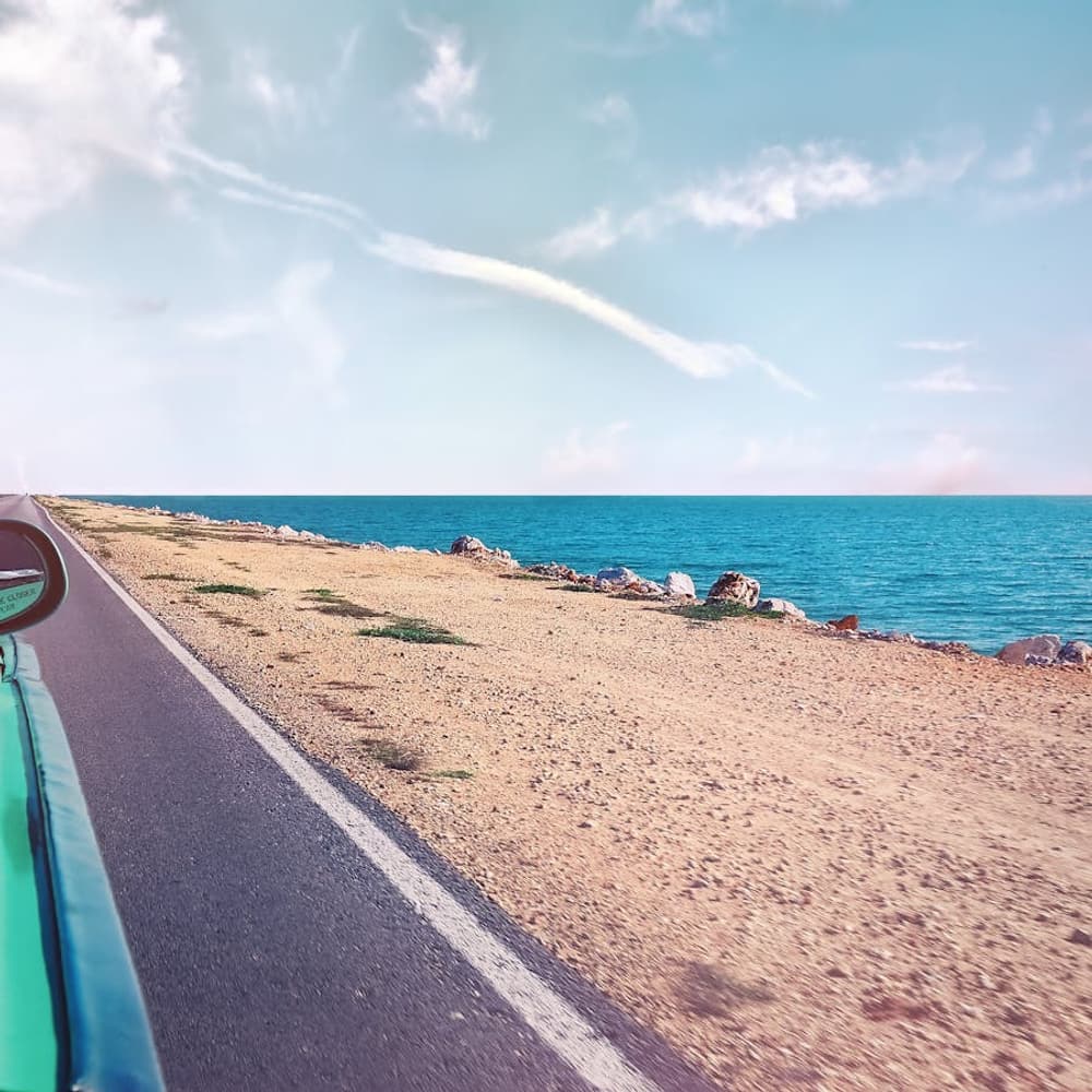 Scenic highway stretching through dramatic landscape with long perspective view