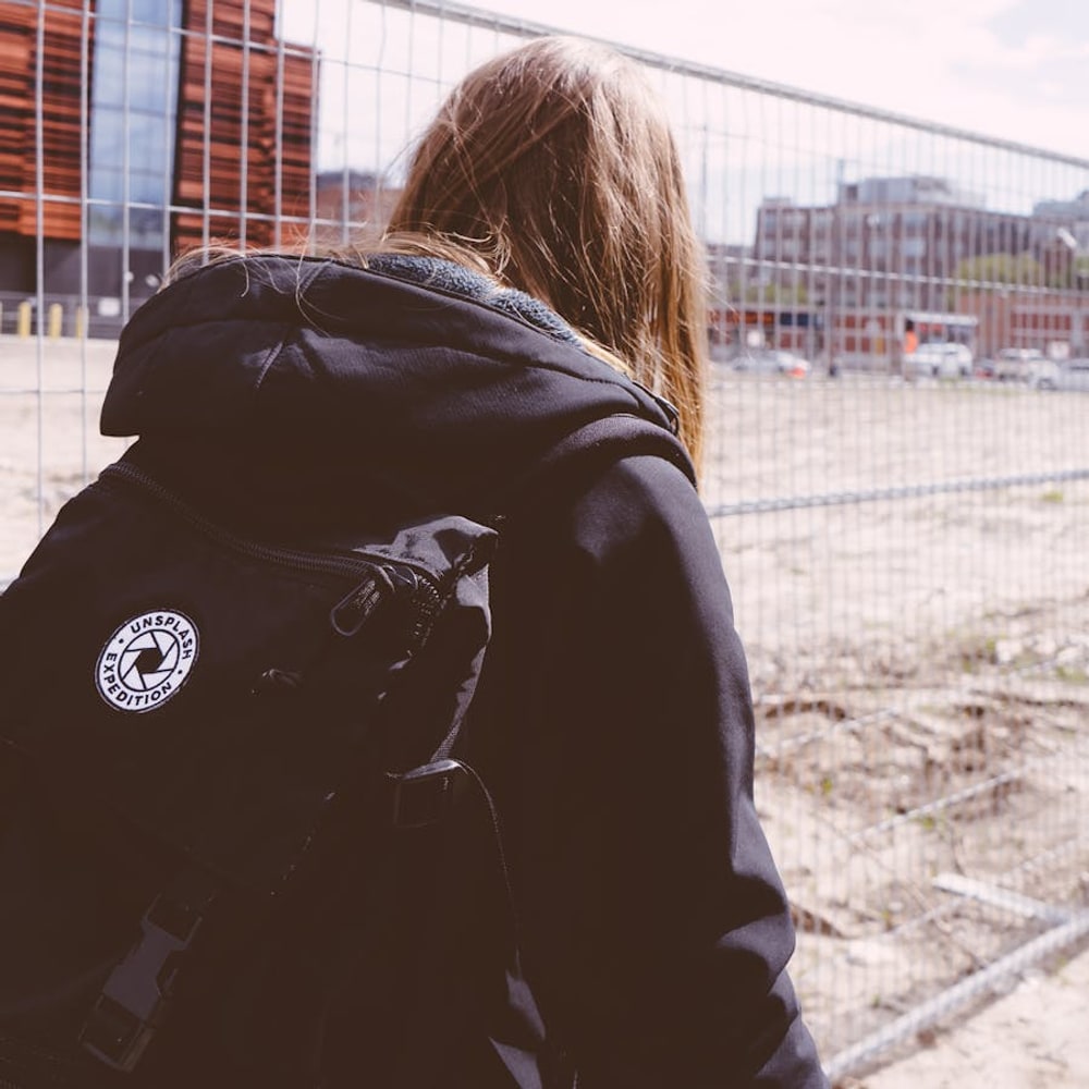 Black travel backpack displayed for size and style comparison