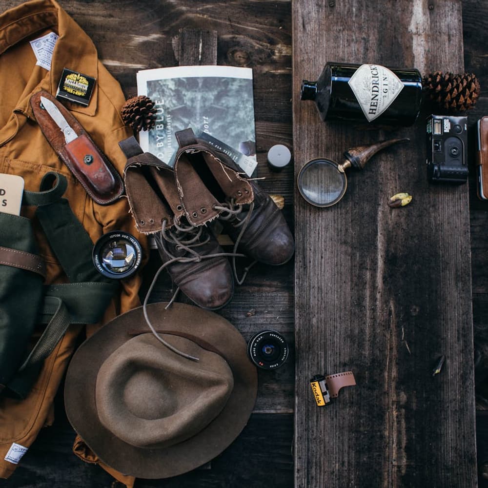 Flat lay of assorted travel supplies and accessories arranged for packing